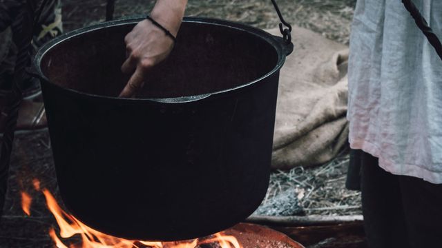 An old cookpot over a fire. 