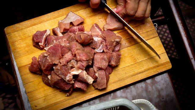 Meat on a chopping board.  